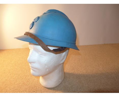 A BLUE PAINTED FRENCH ARMY ADRIAN HELMET WITH LEATHER LINING 