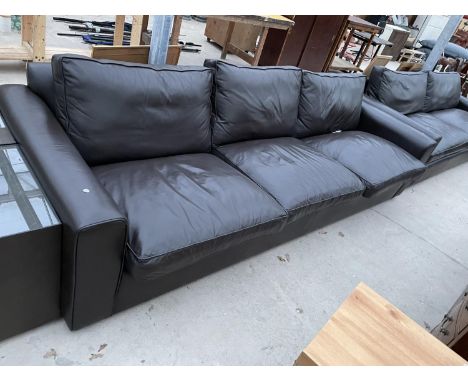 A LARGE LEATHER THREE SEATER SOFA 