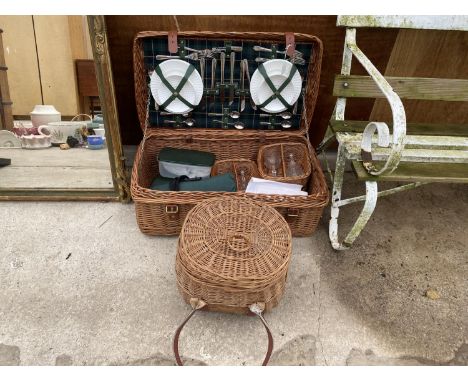 A WHICKER PICNIC HAMPER COMPLETE WITH GLASS, CERAMIC AND FLAT WARE AND A FURTHER WHICKER BASKET 
