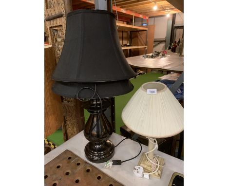 A LARGE METAL TABLE LAMP WITH TWO BLACK SHADES AND A WOODEN BASED TABLE LAMP WITH GRAPES AND FRUIT DECORATION WITH FABRIC SHA