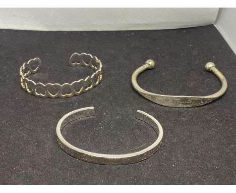 THREE SILVER BANGLES TO INCLUDE A HEART BANGLE, LOVE YOU BANGLE AND AN IDENTITY STYLE ALL MARKED 925 