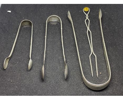 THREE PAIRS OF HALLMARKED SILVER SUGAR TONGS AND A FORK WITH AMBER COLOURED STONE 