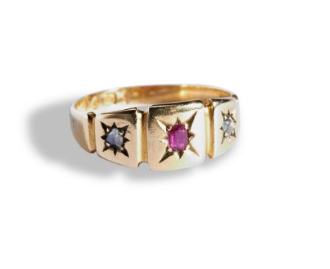 A RUBY AND DIAMOND GYPSY SET RING.  the central cushion cut ruby, gypsy set flanked by two closed back rose cut diamonds, to 