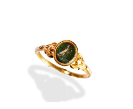A 19TH CENTURY BLOODSTONE INTAGLIO SEAL RING, CIRCA 1830 carved to depict an owl, collet set&nbsp;between engraved shoulders 
