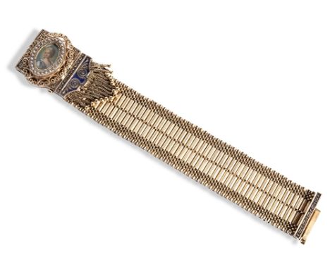 A GOLD, PEARL AND ENAMEL BRACELET, CIRCA 1860-80 WITH LATER WATCH INSERT a wide fancy mesh link bracelet leading to two slide