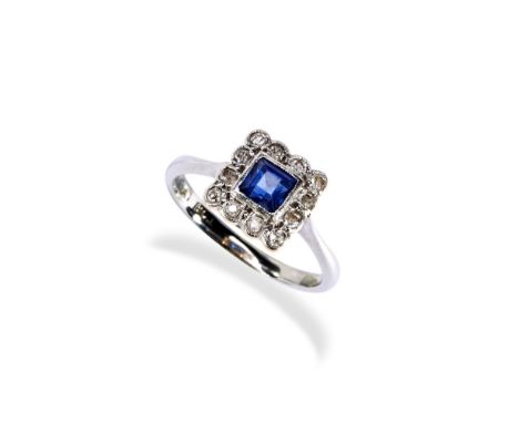 A SAPPHIRE &amp; DIAMOND PLAQUE RING CIRCA 1900. the millegrain square cut sapphire surrounded by twelve millegrain set small