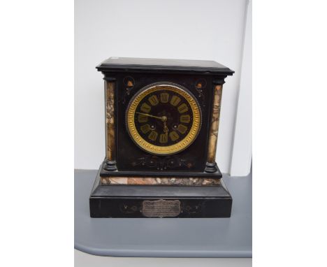 A 20th century French slate and marble mantel clock, the black dial with Roman numerals, two front winding holes, ornate stee