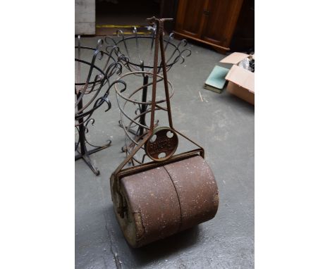 An Ironcrete lawn roller together with a vintage push mower