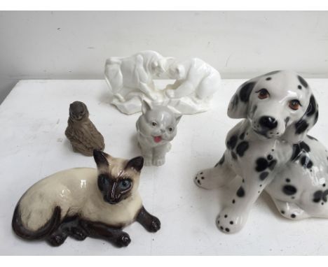 Five ceramic figurines including: a Royal Doulton Siamese cat model 1559, a laughing cat by Porcelanas Miguel Requena, Valenc