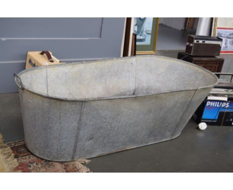 A Vintage tin bath with two handles 120cm length, 36cm depth, 37cm to 33cm width   (af)