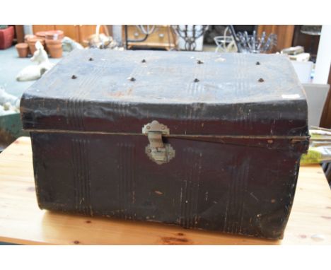 A black painted military trunk with travel and ID labels 70 x 45 x 40cm