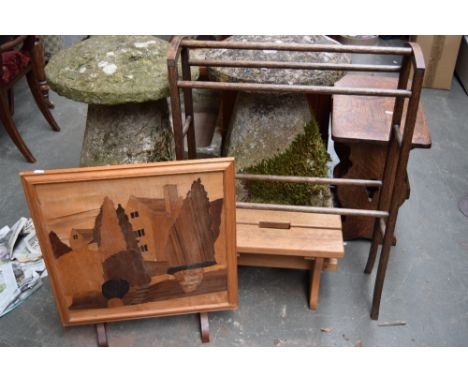 An oak towel rail, a decorative fireguard with brass relief front and a footstool