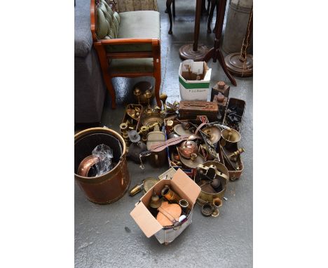 A mix lot of brass, coper and metal ware including horse buckle, candlestick holder, plates, commemorative ware and various p