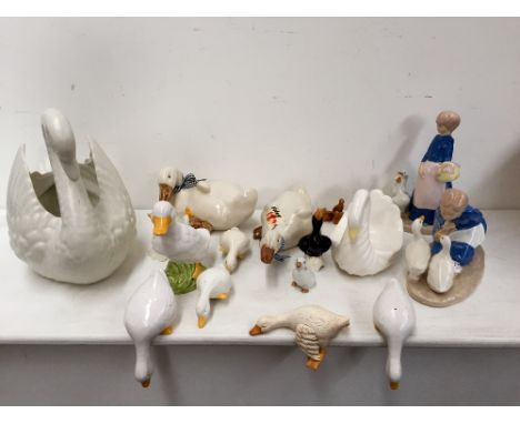 A selection of ceramic animals ornaments mostly ducks and swans including one signed H Lloyds at the base