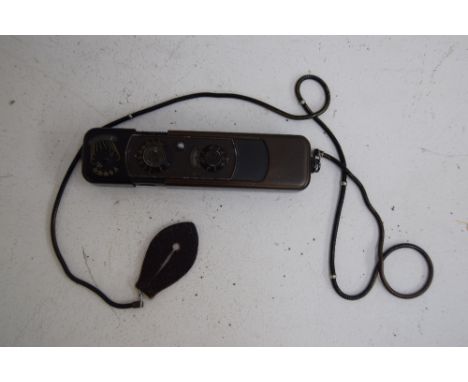 Black Minox B miniature pocket camera,complan 1:3,5 F=15mm, number 649 103, come with a chain which can also be used as a dis
