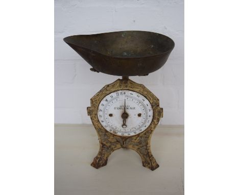 Four vintage scales with some weights, one with white enamel front inscribe “improved family scale”