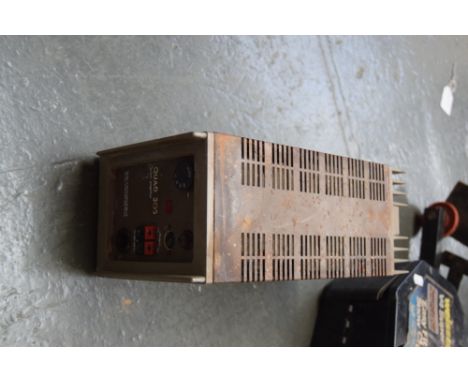 A Quad 303 Power Amplifier made in Huntingdon England by the Accoustical Mfg Co Ltd