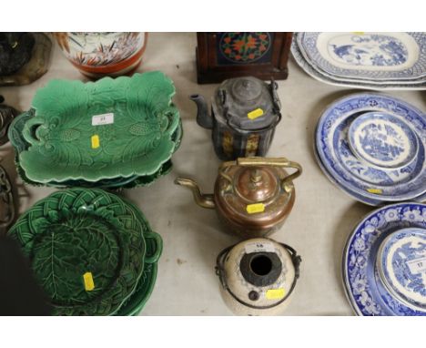 A small eastern copper and brass kettle; together with a Chinese teapot; and an oriental blue and white swing handled pot