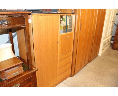 A light oak veneered tallboy with sliding glass doors