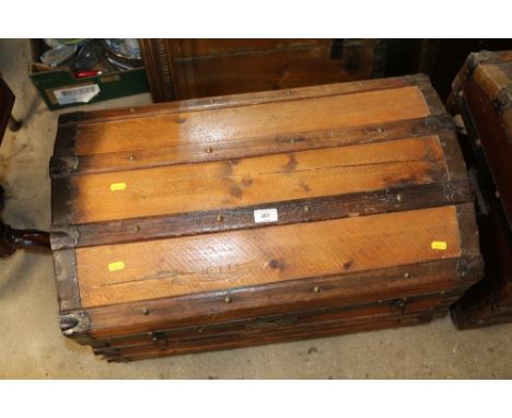 A wooden and metal bound dome topped trunk 