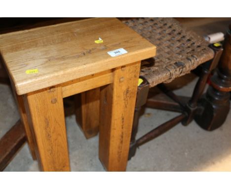 A heavy light oak square topped coffee table; and a string topped stool 
