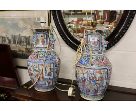 A pair of 19th Century Chinese famille rose enamel painted converted table lamps 