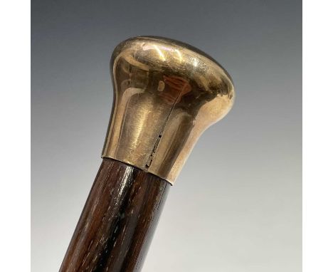 A gentleman's cane, with engraved 9ct gold handle, length 89cm.Provenance: From the Estates of June Barrington Ward & Maggie 