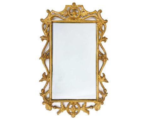 An 18th century style carved giltwood wall mirror, pierced and carved with trailing foliage and flowers, height 90cm, width 5