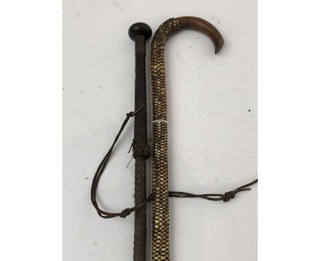 An intriguing folk art walking stick, 19th century, covered with wire bound woven grass, simulating snakeskin, length 92cm, t