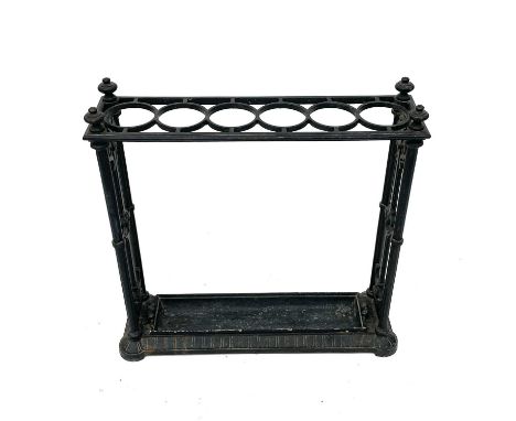 A Victorian Coalbrookdale cast iron stick stand, with six divisions and flowerhead and scroll cast ends, stamped marks and de