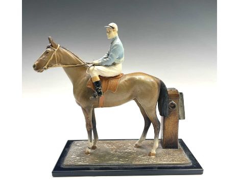 An early 20th century continental cold painted spelter table cigarette lighter modelled as a racehorse and jockey, height 18c