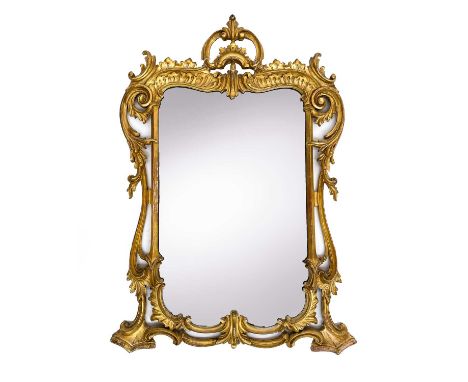 A rococo style giltwood wall mirror, 19th century, with typical scrolls and foliage, height 103cm, width 72cm.Alan Bennett (1