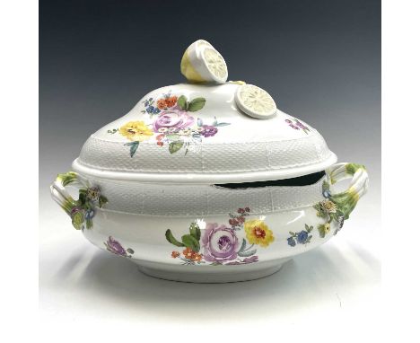 A Meissen porcelain tureen and cover, mid 18th century, with sliced lemon finial and moulded asparagus handles, Ozier moulded