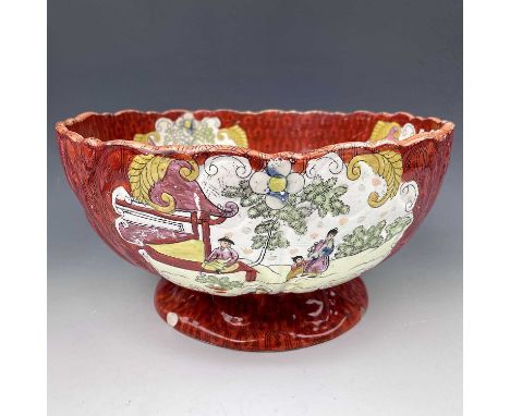 A 19th century Ironstone pottery punch bowl printed and overpainted in enamels printed mark to base PEKIN JAPAN IRONSTONE, di