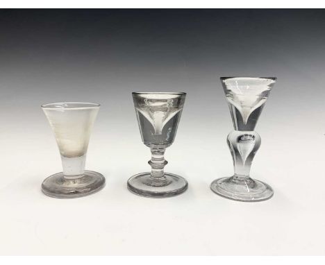 An early Georgian deceptive wine glass, with teardrop baluster stem, height 12.2cm, together with another deceptive wine and 