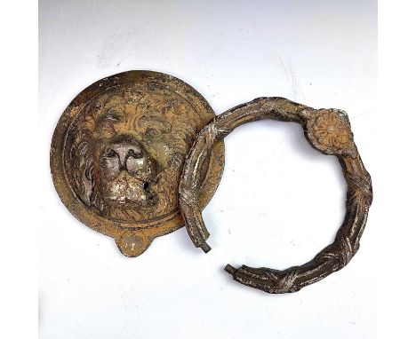 A substantial brass door knocker, 20th century, cast as a lion mask, diameter 21cm.Condition report: The knocker currently de