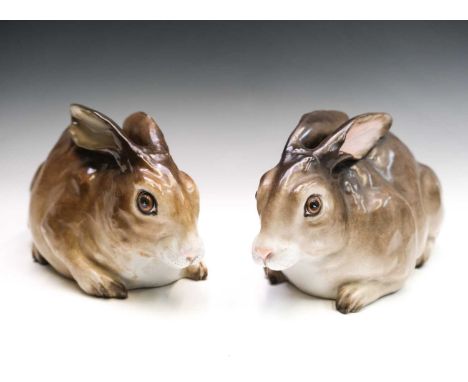 A good matched pair of Meissen Marcolini period figures of rabbits, circa 1810, modelled in a crouching position, crossed swo