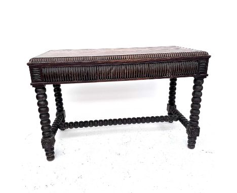 A Victorian oak serving table with applied split bobbin mouldings, fitted three drawers and on bobbin turned supports, height