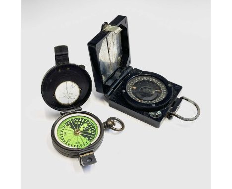 A brass compass made by F Barker &amp; son London with green card dial, together with a bakelite WWII marching compass by TG 