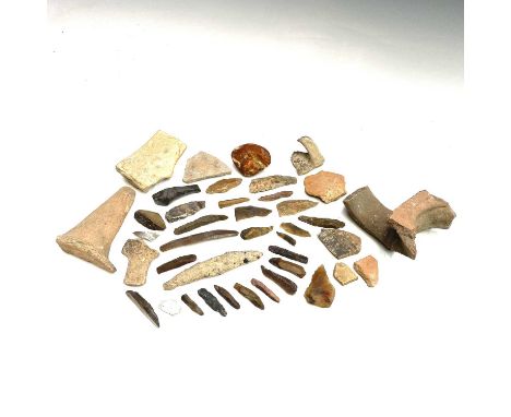 Neolithic knapped flint tools together with a collection of pottery shards and a piece of unpolished amber.Provenance: From t