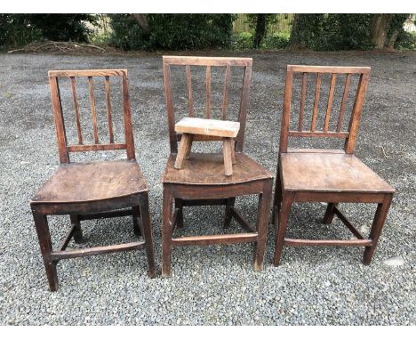 Three similar early 19th century provincial made oak and fruitwood chairs on boarded seats and square legs, together with an 