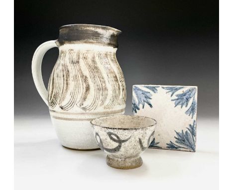 Studio pottery, A Leach blue and white tile with impressed marks, a possibly Lowerdown pottery jug painted marks to base and 