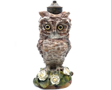 A Victorian porcelain oil lamp base, probably Moore Brothers, circa 1880, modelled as an owl, with inset glass eyes on a flow