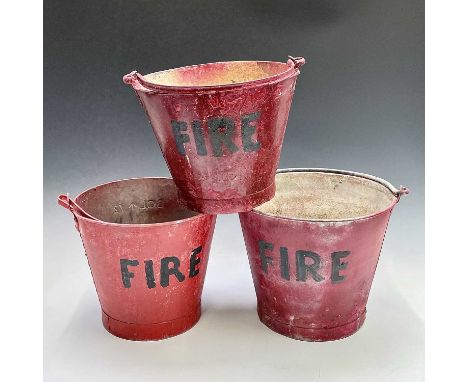 Three red painted 'FIRE' buckets, one with a War Ministry broad arrow, tallest height 28.5cm.