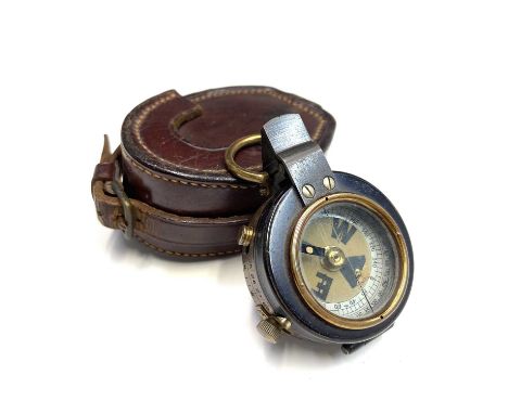 An early 20th century Verner's Service Pattern type brass military compass stamped BROWNS GLASGOW with glazed hinged lid and 