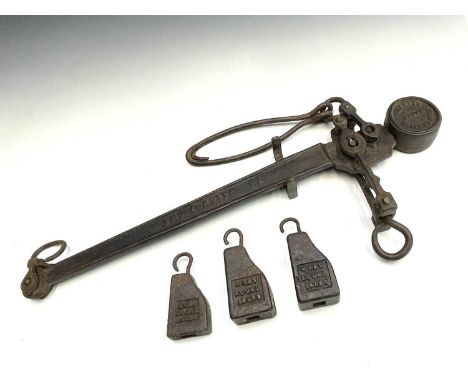 A cast iron steelyard balance marked R Johnstone Maker REDRUTH with three weights, length 78cm.