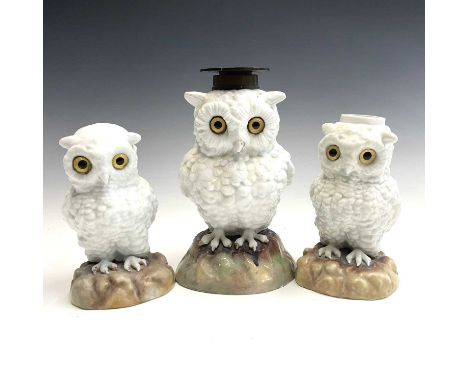 A Continental porcelain owl oil lamp base, circa 1890, with inset glass eyes on a mound base, height 20cm, together with a sm