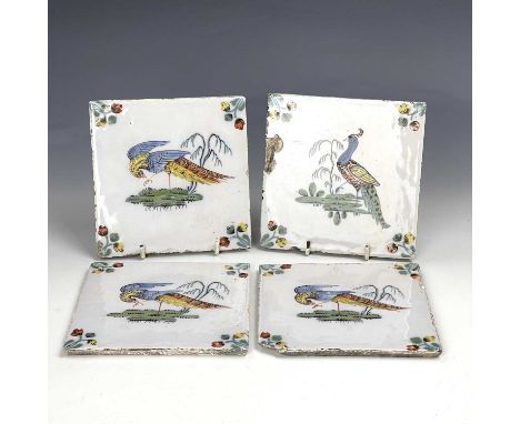 Four good Liverpool polychrome Delft tiles, painted with birds in Fazackerly colours, 13cm, x 13cm.Condition report: Chips an