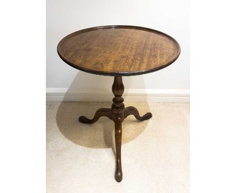 A George III mahogany wine table, the dished top with chequer stringing on a turned column and tripod base, height 65cm, diam