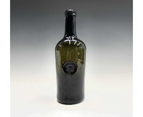 A sealed wine bottle, late 18th/early 19th century, the seal with a C below a crown, height 26.5cm.Provenance: From the Estat